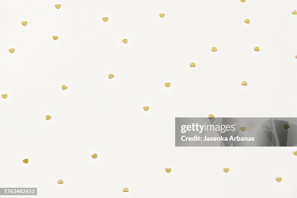 golden  star confetti on the white background - star confetti white background stockfoto's en -beelden