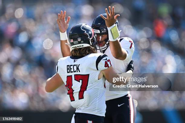 Andrew Beck of the Houston Texans celebrates after scoring a touchdown with C.J. Stroud of the Houston Texans during the first quarter of the game...