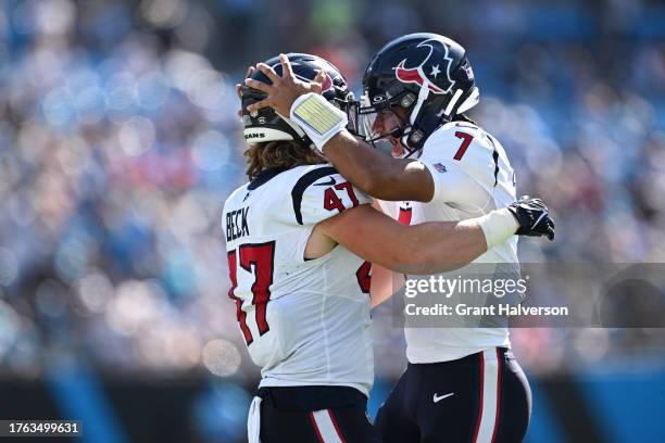 Andrew Beck of the Houston Texans celebrates after scoring a touchdown with C.J. Stroud of the Houston Texans during the first quarter of the game...