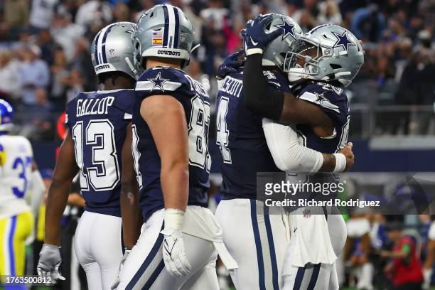 Dak Prescott of the Dallas Cowboys hugs CeeDee Lamb of the Dallas Cowboys after a second quarter touchdown against the Los Angeles Rams at AT&T...