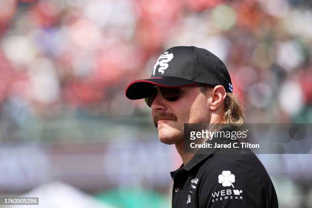 Valtteri Bottas of Finland and Alfa Romeo F1 looks on from the drivers parade prior to the F1 Grand Prix of Mexico at Autodromo Hermanos Rodriguez on...