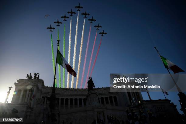 Aermacchi MB-339 aircrafts of the Italian Air Force aerobatic unit "Frecce Tricolori" spread smoke with the colors of the Italian flag over Altare...