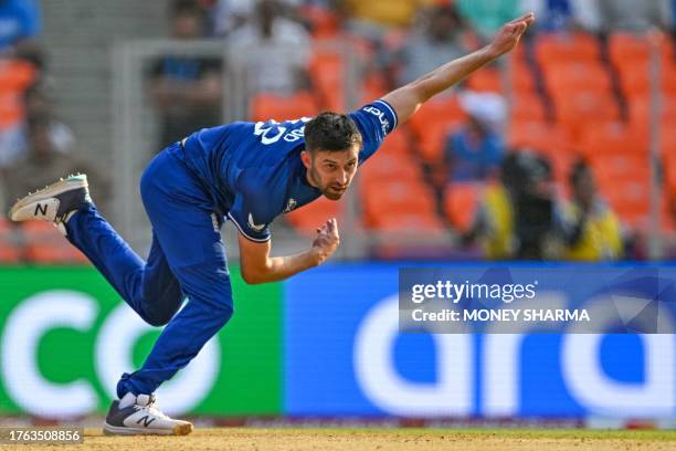 England's Mark Wood bowls during the 2023 ICC Men's Cricket World Cup one-day international match between England and Australia at the Narendra Modi...