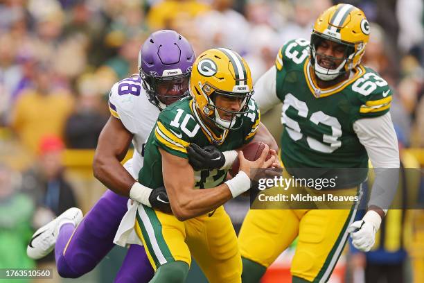 Wonnum of the Minnesota Vikings sacks Jordan Love of the Green Bay Packers in the first quarter of a game at Lambeau Field on October 29, 2023 in...