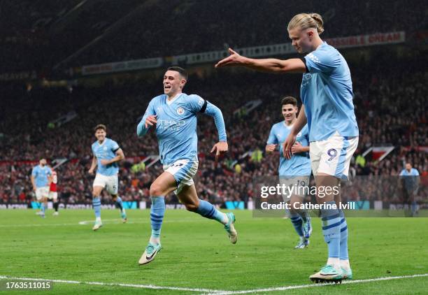 Phil Foden of Manchester City celebrates alongside teammate Erling Haaland after scoring the team's third goal during the Premier League match...