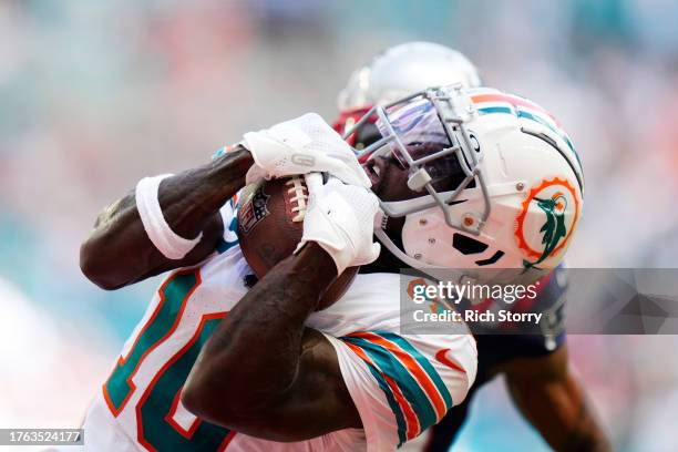 Tyreek Hill of the Miami Dolphins catches a touchdown during the first quarter against the New England Patriots at Hard Rock Stadium on October 29,...