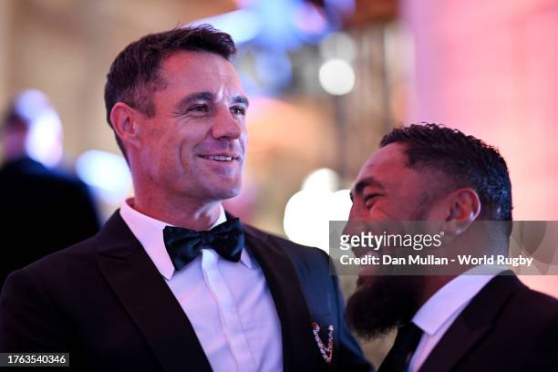 Former Rugby Player Dan Carter speaks with Bundee Aki of Ireland as they arrive prior to the World Rugby Awards at Opera Garnier on October 29, 2023...