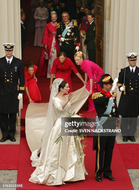Mary Elisabeth Donaldson and Crown Prince Frederik of Denmark wave while bridesmaides from right to left, Amber Petty, Jane Stephens and Patricia...