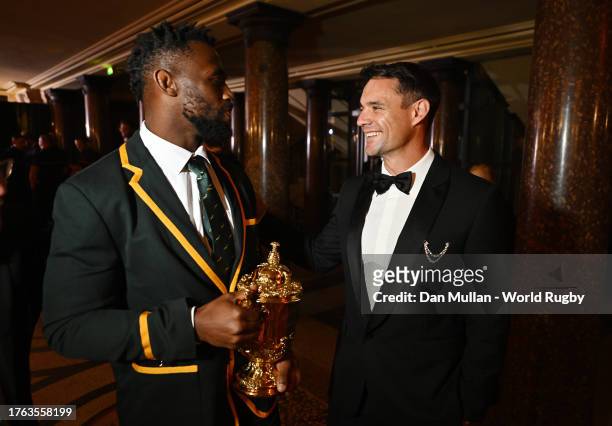 Siya Kolisi of South Africa and Dan Carter, former New Zealand international rugby union player, interact prior to the World Rugby Awards at Opera...
