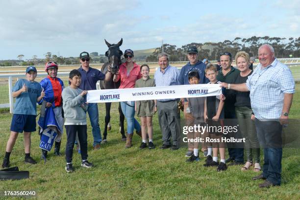 Owners of Dirt On Harry after winning the Valton Feeding Solutions BM58 Handicap at Mortlake Racecourse on November 04, 2023 in Mortlake, Australia.