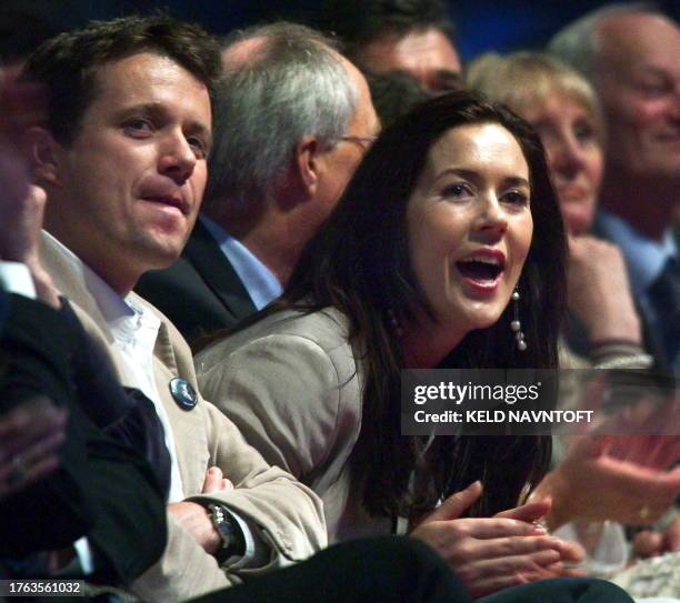 Danish Crown Prince Frederik and his Australian fiancee Mary Donaldson attend the Rock'n'Royal concert at Copenhagen's Parken Stadium 07 May 2004,...