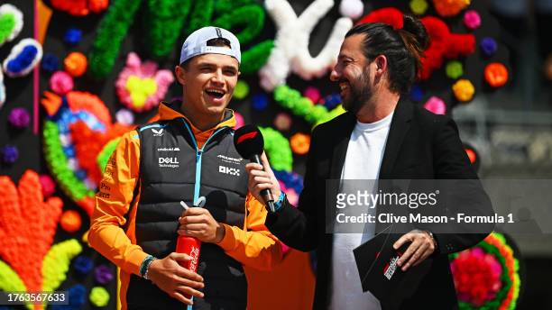 Lando Norris of Great Britain and McLaren talks to the crowd on the fan stage prior to the F1 Grand Prix of Mexico at Autodromo Hermanos Rodriguez on...