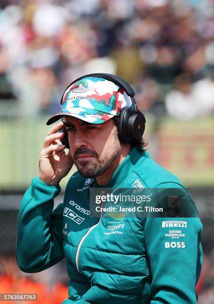 Fernando Alonso of Spain and Aston Martin F1 Team looks on in the drivers parade prior to the F1 Grand Prix of Mexico at Autodromo Hermanos Rodriguez...