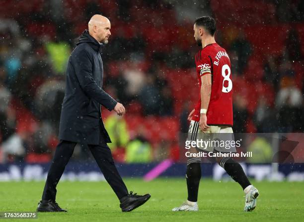 Erik Ten Hag manager of Manchester United walks past Bruno Fernandes of Manchester United following the Premier League match between Manchester...