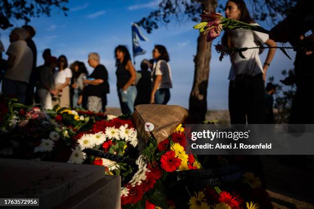 Mourners grieve during the funeral of Lili Itamari and Ram Itamari a couple from Kibbutz Kfar Aza who were killed when Hamas militants attacked the...