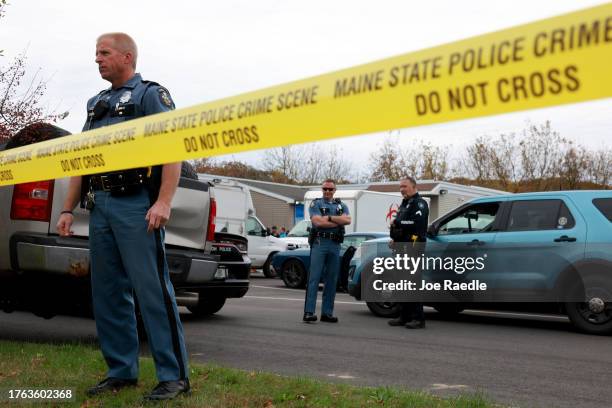 Law enforcement personnel stand outside of Schemengees Bar, where one of two mass shootings took place on October 29, 2023 in Lewiston, Maine. Mr....