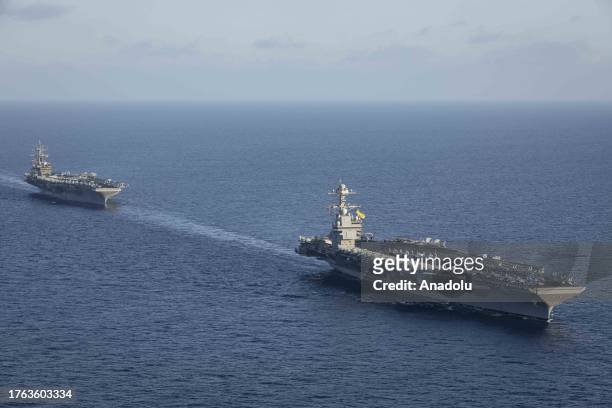 An aerial view of aircraft carriers of the United States Navy USS Gerald R. Ford and USS Dwight D. Eisenhower together in eastern Mediterranean on...