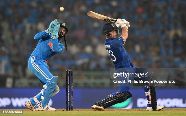 Liam Livingstone of England and KL Rahul both miss the ball during the ICC Men's Cricket World Cup India 2023 between India and England at BRSABVE...