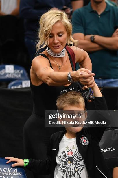 Former basketball player of Serbia national team Milica Dabovic with her son react during the 2023/2024 Turkish Airlines EuroLeague, Round 5 match...