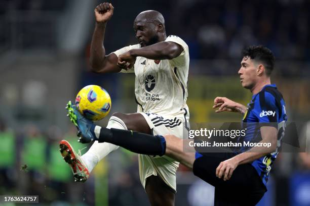 Romelu Lukaku of AS Roma challenges Alessandro Bastoni of FC Internazionale as he clears the ball during the Serie A TIM match between FC...