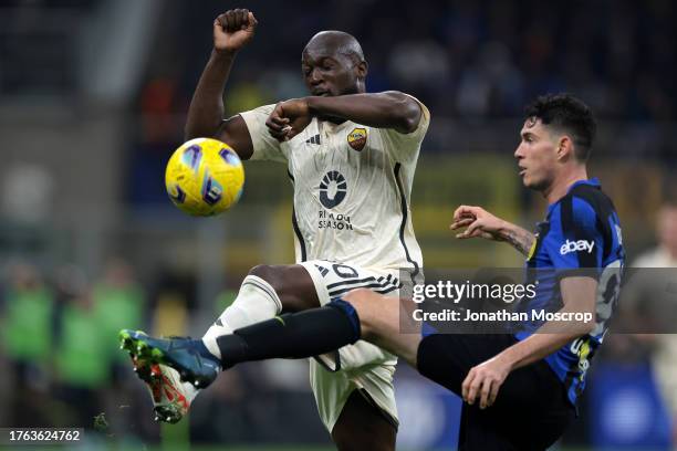 Romelu Lukaku of AS Roma challenges Alessandro Bastoni of FC Internazionale as he clears the ball during the Serie A TIM match between FC...