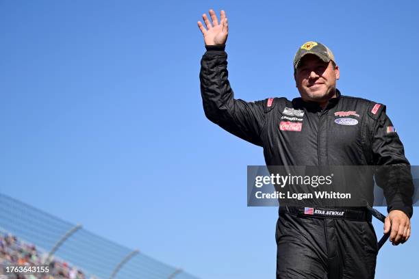 Ryan Newman, driver of the Biohaven/Jacob Co Ford, waves to fans as he walks onstage during driver intros prior to the NASCAR Cup Series Xfinity 500...