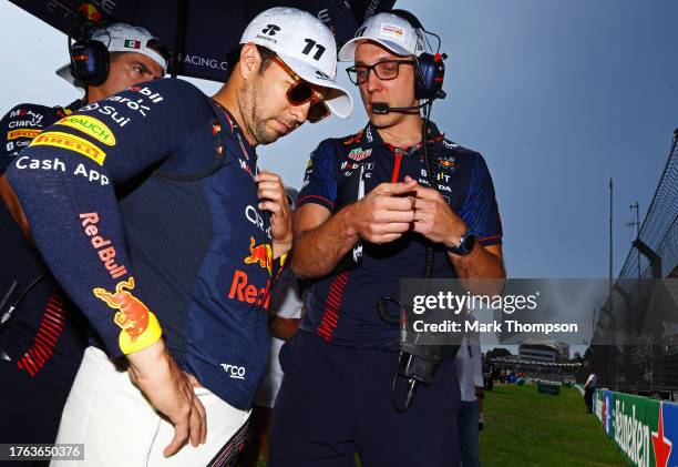 Sergio Perez of Mexico and Oracle Red Bull Racing talks with race engineer Hugh Bird on the grid prior to the F1 Grand Prix of Mexico at Autodromo...