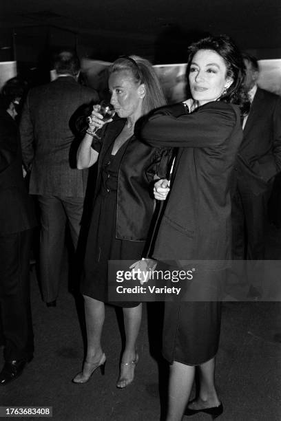 Lyn Revson and Anouk Aimee attend an event at the Cafe Carlysle in New York City on April 12, 1984.