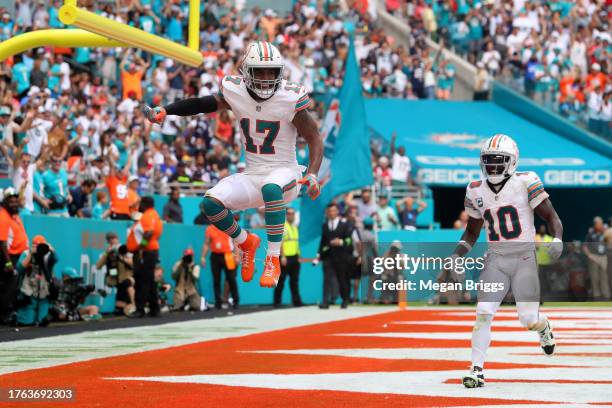 Jaylen Waddle of the Miami Dolphins and Tyreek Hill of the Miami Dolphins celebrate after Waddle's receiving touchdown during the fourth quarter...