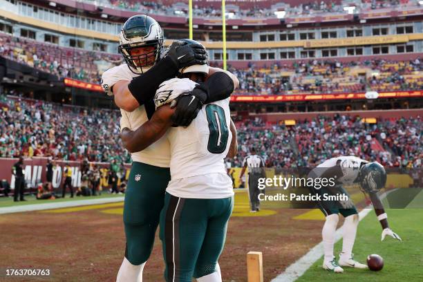 Andre Swift of the Philadelphia Eagles celebrates a fourth quarter touchdown against the Washington Commanders at FedExField on October 29, 2023 in...