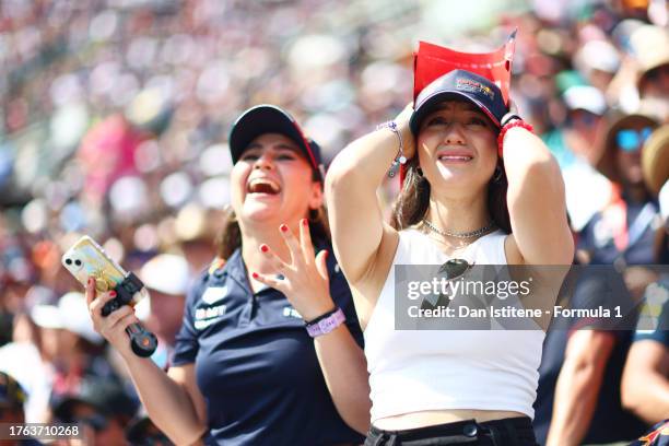 Fans react as they watch the action from a grandstand during the F1 Grand Prix of Mexico at Autodromo Hermanos Rodriguez on October 29, 2023 in...