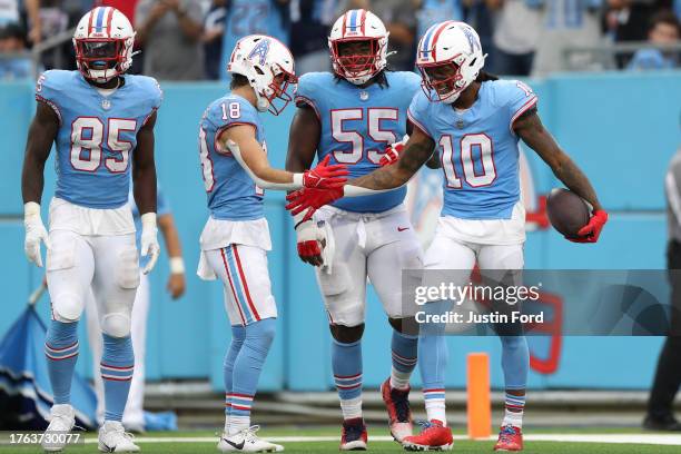 DeAndre Hopkins of the Tennessee Titans celebrates with teammates after scoring a touchdown during the third quarter of the game against the Atlanta...