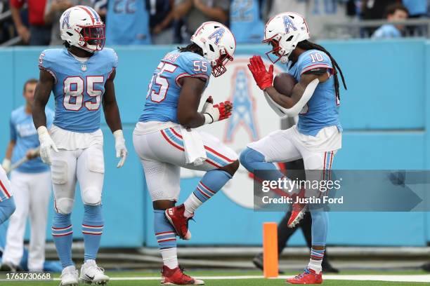 DeAndre Hopkins of the Tennessee Titans celebrates with teammates after scoring a touchdown during the third quarter of the game against the Atlanta...