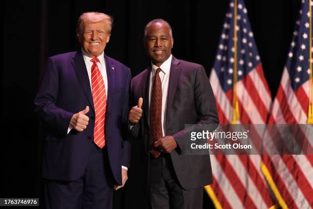 Republican presidential candidate former U.S. President Donald Trump greets former HUD Secretary Ben Carson during a campaign event where he received...