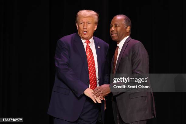 Republican presidential candidate former U.S. President Donald Trump greets former HUD Secretary Ben Carson during a campaign event where he received...