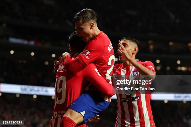 Alvaro Morata of Atletico de Madrid celebrates with teammates Rodrigo Riquelme and Nahuel Molina after scoring the team's second goal during the...