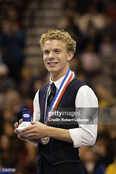 Timothy Goebel poses on the winner's podium with his silver medal after the State Farm US Figure Skating Championships on January 18, 2003 at the...