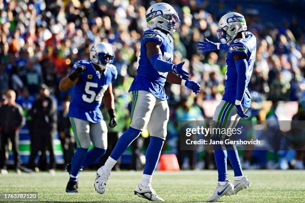 Boye Mafe of the Seattle Seahawks celebrates a stop during the second quarter of a game against the Cleveland Browns at Lumen Field on October 29,...