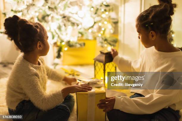 girls playing with candle lantern - christmas dark stock pictures, royalty-free photos & images