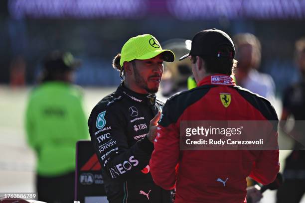 Second placed Lewis Hamilton of Great Britain and Mercedes talks with Third placed Charles Leclerc of Monaco and Ferrari in parc ferme after the F1...