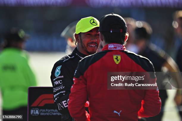 Second placed Lewis Hamilton of Great Britain and Mercedes talks with Third placed Charles Leclerc of Monaco and Ferrari in parc ferme after the F1...