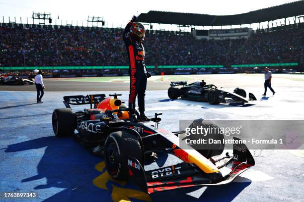 Race winner Max Verstappen of the Netherlands and Oracle Red Bull Racing celebrates on his car in parc ferme the F1 Grand Prix of Mexico at Autodromo...