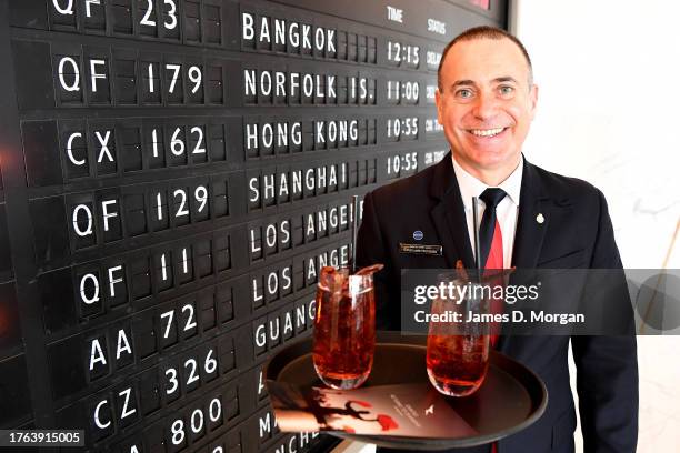 Qantas lounge staff greet passengers before they board QF129 Sydney to Shanghai on October 30, 2023 in Sydney, Australia. Qantas is resuming flights...