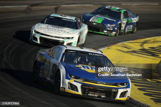 Chase Elliott, driver of the NAPA Auto Parts Chevrolet, Carson Hocevar, driver of the Sunseeker Resorts Chevrolet, and Ryan Newman, driver of the...