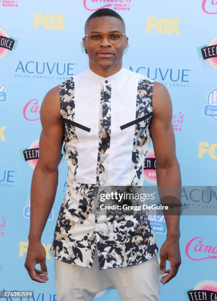 Basketball player Russell Westbrook who plays for the Oklahoma City Thunder arrives at the 2013 Teen Choice Awards at Gibson Amphitheatre on August...