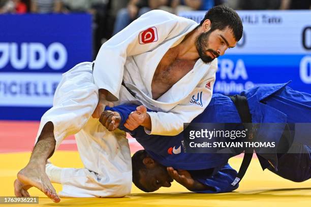 Georgia's Tato Grigalashvili and France's Alpha Oumar Djalo compete in the men's under 81 kg semi-final during the European Judo Championships 2023...