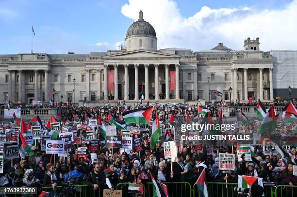 Protesters gather with placards and flags during the 'London Rally For Palestine' in Trafalgar Square, central London on November 4 calling for a...