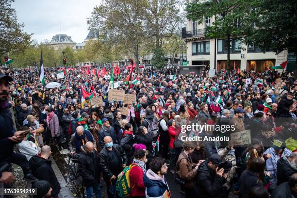 People gather as they carry Palestinian flags and banners to stage a demonstration in support of Palestinians in Paris, France on November 04, 2023.