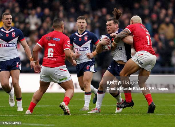 England's Robbie Mulhern is tackled by Tonga's Tyson Frizell during the International Test Series match at Headingley Stadium, Leeds. Picture date:...
