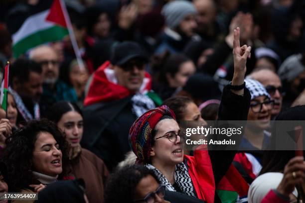 People gather as they carry Palestinian flags and banners to stage a demonstration in support of Palestinians in Paris, France on November 04, 2023.